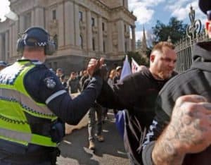 Victoria Police were criticised for publicly shaking hands with a United Patriots Front marcher in July 2015. The group later labelled the officer a 'patriot' of their cause. Photograph: Twitter
