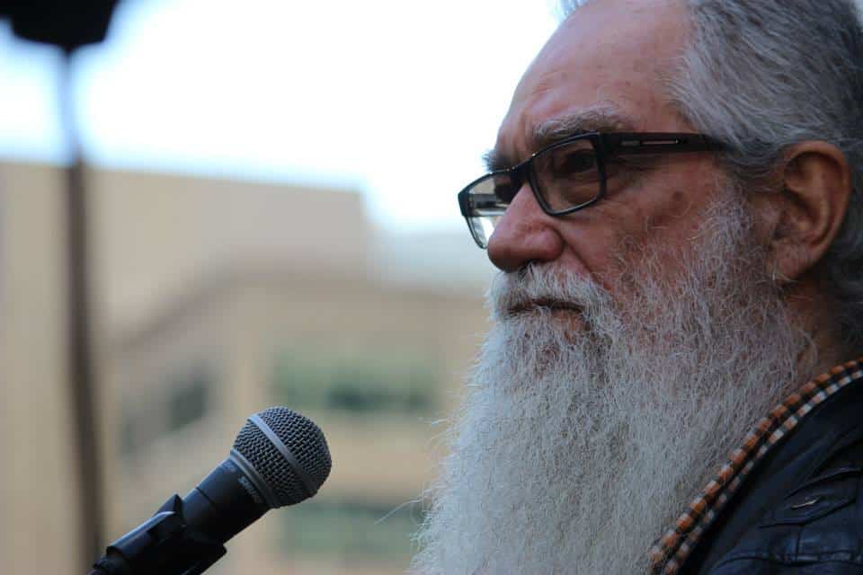 Terry Mason standing in front of a microphone